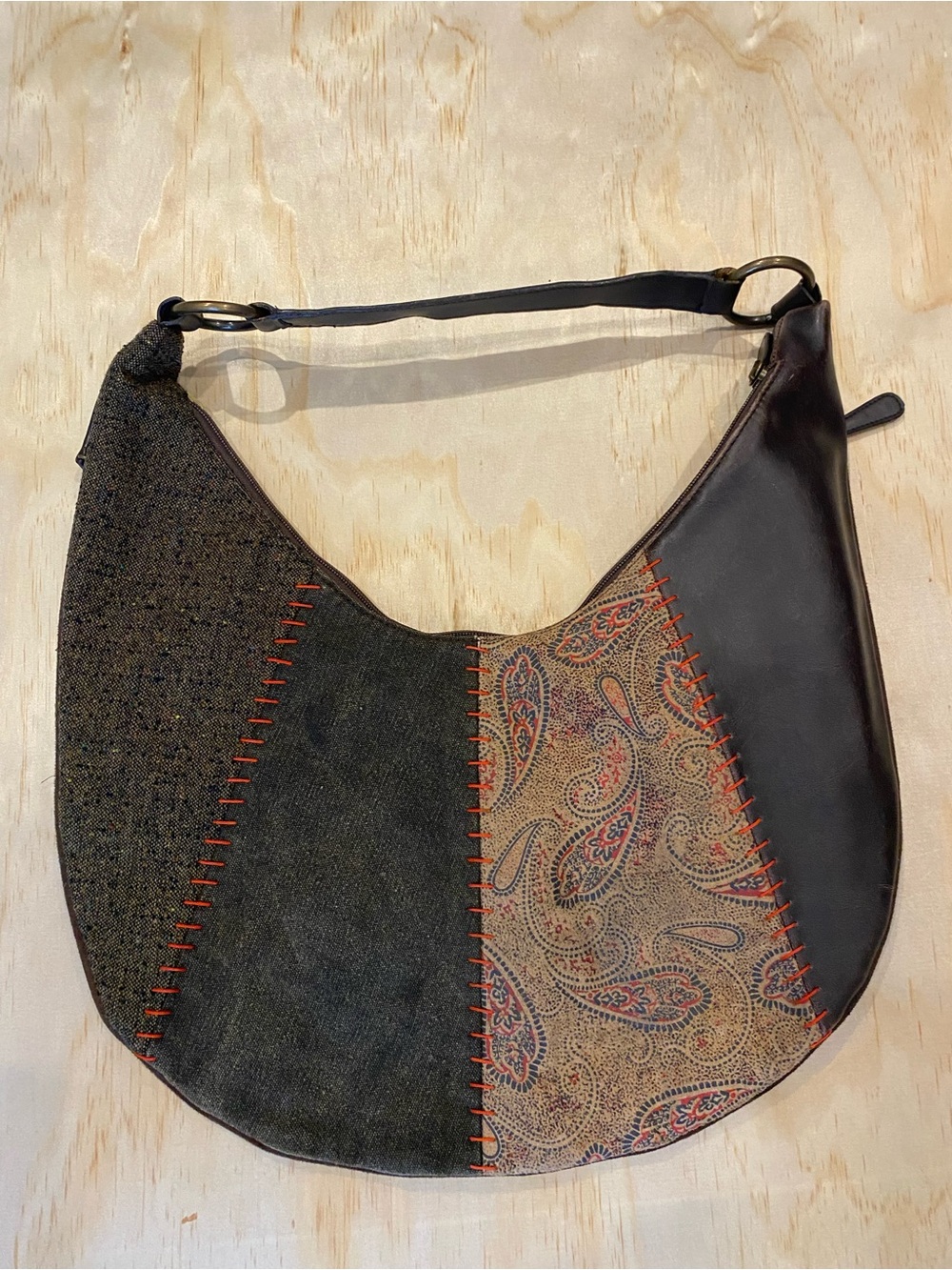 brown leather hobo bag with paisley pattern